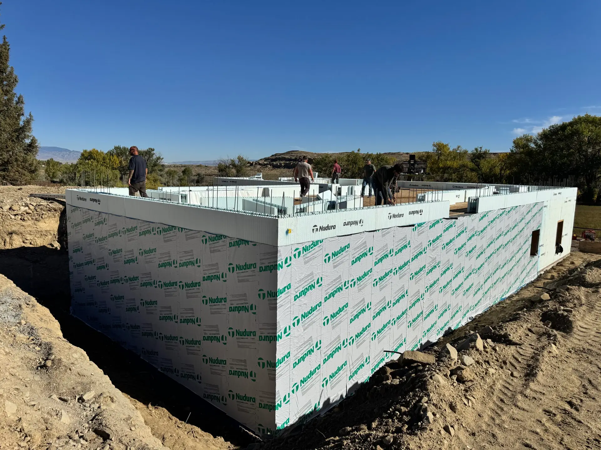 Insulated concrete form (ICF) foundation under construction, showcasing Nudura forms before concrete placement for an energy efficient custom home.